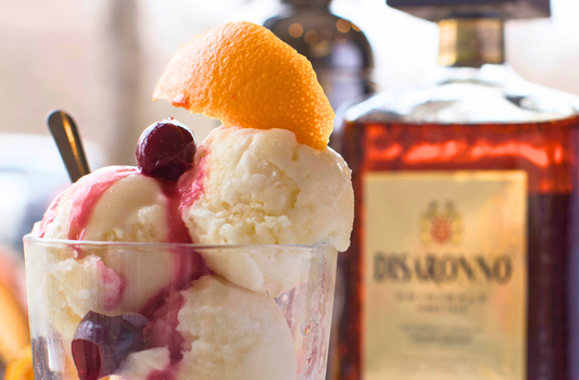 Amaretto ice cream with cherry and orange peel